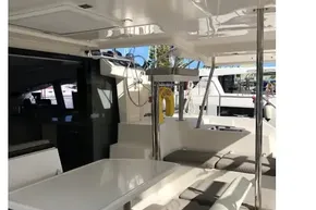 Spacious deck area of a 2020 Leopard 40 catamaran with seating and table.