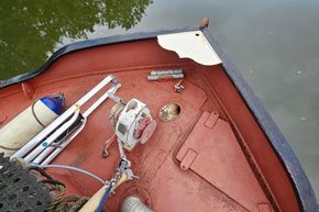 Bow of 1926 Dutch Barge Luxemotor with ropes and equipment on deck.