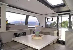 Interior of 2017 Leopard 45 catamaran with modern seating and dining area.