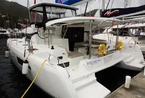 2020 Lagoon 42 catamaran docked at marina, rear view.