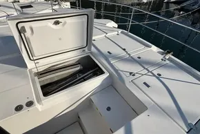 Open storage compartment on 2024 Leopard 40 Powercat yacht deck, docked at marina.