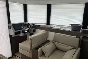 Interior of 2024 Leopard 40 Powercat with modern helm and comfortable seating.
