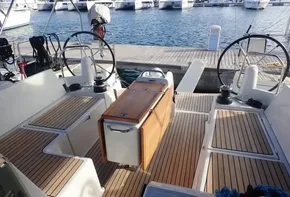 2019 Jeanneau Sun Odyssey 440 yacht cockpit with dual steering wheels and teak flooring.