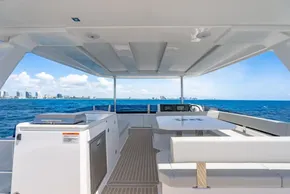 2025 Leopard 40 Powercat yacht interior with ocean view, featuring modern seating and sleek design.
