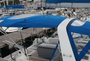 2019 Beneteau Oceanis 41.1 sailboat docked with blue canopy and sleek design.