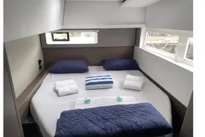 Luxurious cabin interior of 2022 Leopard 45 yacht with neatly arranged bedding.