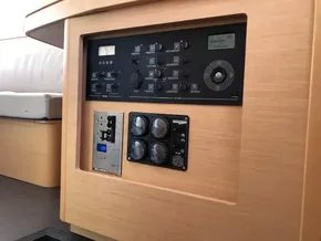 Control panel of a 2020 Lagoon 42 catamaran with various switches and gauges.