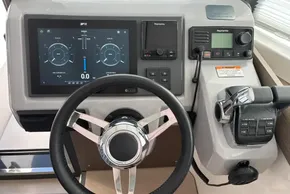 Control panel of 2024 Leopard 40 Powercat with steering wheel and navigation displays.