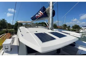 2022 Leopard 45 catamaran with solar panels, docked in a sunny marina.