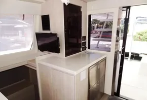 Interior of 2017 Leopard 43 Powercat with modern kitchen and TV.
