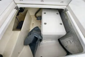 Storage compartment in a 2019 Leopard 50 yacht, featuring a secured white box and coiled rope.