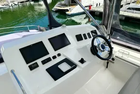 Helm of 2022 Leopard 53 Powercat with modern navigation displays and steering wheel.