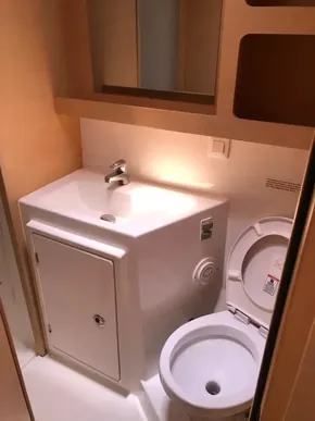 Modern bathroom in 2020 Lagoon 42 catamaran with sink and toilet.