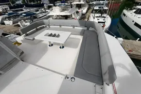 Luxurious seating area on a 2020 Leopard 50 yacht, docked at a marina.