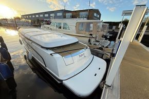 2015 Alfastreet 23 boat docked at marina during sunset, with other boats nearby.