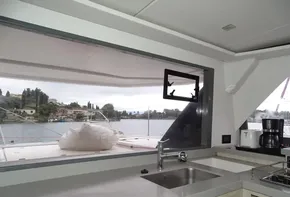 Interior view of 2017 Leopard 45 yacht kitchen with lake view.