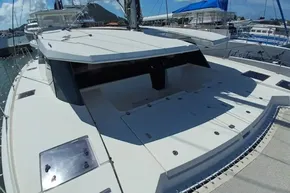 2018 Leopard 45 catamaran docked, showcasing spacious deck and sleek design.