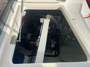 Engine compartment of a 2019 Leopard 45 catamaran, showcasing mechanical components.
