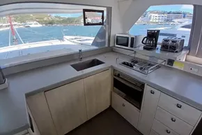 Modern kitchen interior on 2018 Leopard 45 yacht with appliances and ocean view.