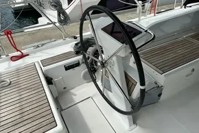 Steering wheel of 2023 Beneteau Oceanis 51.1 yacht with teak decking.