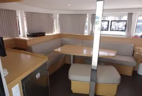 Interior of 2020 Lagoon 42 catamaran with spacious dining area and modern furnishings.