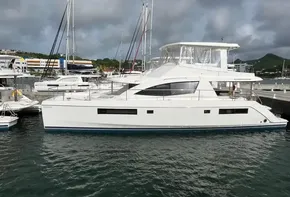 2019 Leopard 51 Powercat yacht docked in marina, overcast sky.