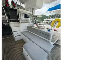 2019 Leopard 50 yacht interior with cushioned seating and wooden flooring.