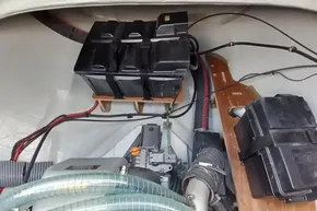 Engine compartment of a 2020 Lagoon 46 catamaran, featuring battery setup and wiring.