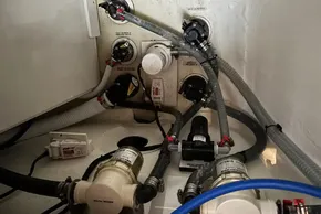 Engine room of 2024 Leopard 40 Powercat with plumbing and filtration systems.
