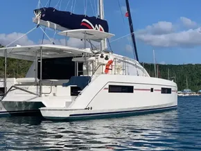 Leopard 40 catamaran, 2020 model, anchored in a scenic bay with clear blue skies.