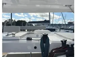 Interior view of a 2025 Leopard 46 yacht at a marina, showcasing deck and equipment.