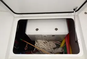 Storage compartment of a 2020 Lagoon 42 catamaran with ropes and equipment.