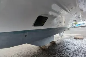 2024 Lagoon 42 catamaran hull on dry dock, showcasing sleek design and craftsmanship.