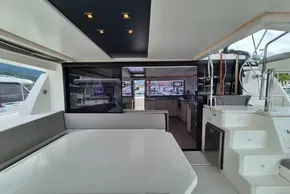 Luxurious interior of 2020 Leopard 45 yacht with modern kitchen and seating area.