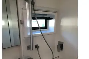 Modern bathroom in 2020 Leopard 40 yacht with sleek shower and window.