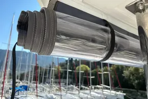 Clear rolled-up cover on 2024 Leopard 40 Powercat, marina background.