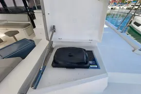 Outdoor grill on 2021 Leopard 50 yacht deck, with marina view in background.