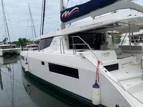 2021 Leopard 45 catamaran docked, featuring sleek design and spacious deck area.