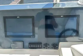 Control panel of 2025 Robertson and Caine Leopard 46 Powercat with dual screens.