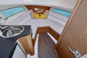 Jeanneau Cap Camarat 7.5 WA - cabin with port side galley and starboard side toilet compartment