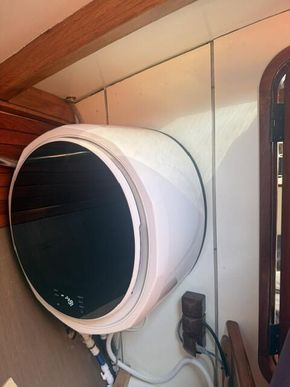 Washing and draying machine located in the bathroom