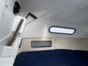 storage in cabin and seat area near engine