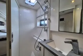 Modern bathroom interior on a 2020 Leopard 45 yacht, featuring sleek fixtures and natural light.