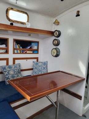 Port berth in main cabin with table in place