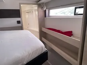 Modern Leopard 50 yacht interior with bed, bunk, and bathroom, 2020 model.
