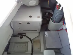 Engine compartment of a 2020 Leopard 43 Powercat with generator and mechanical components.