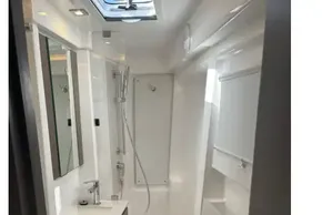 Modern bathroom in 2025 Leopard 46 yacht, featuring sleek design and efficient use of space.