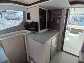 Interior of 2019 Leopard 45 yacht with modern kitchen and marina view.