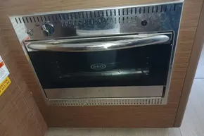 Built-in oven on Lagoon 46 yacht, 2020 model, with stainless steel finish.