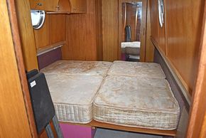 Extending across the boat bed